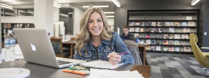 Student studying her class notes.